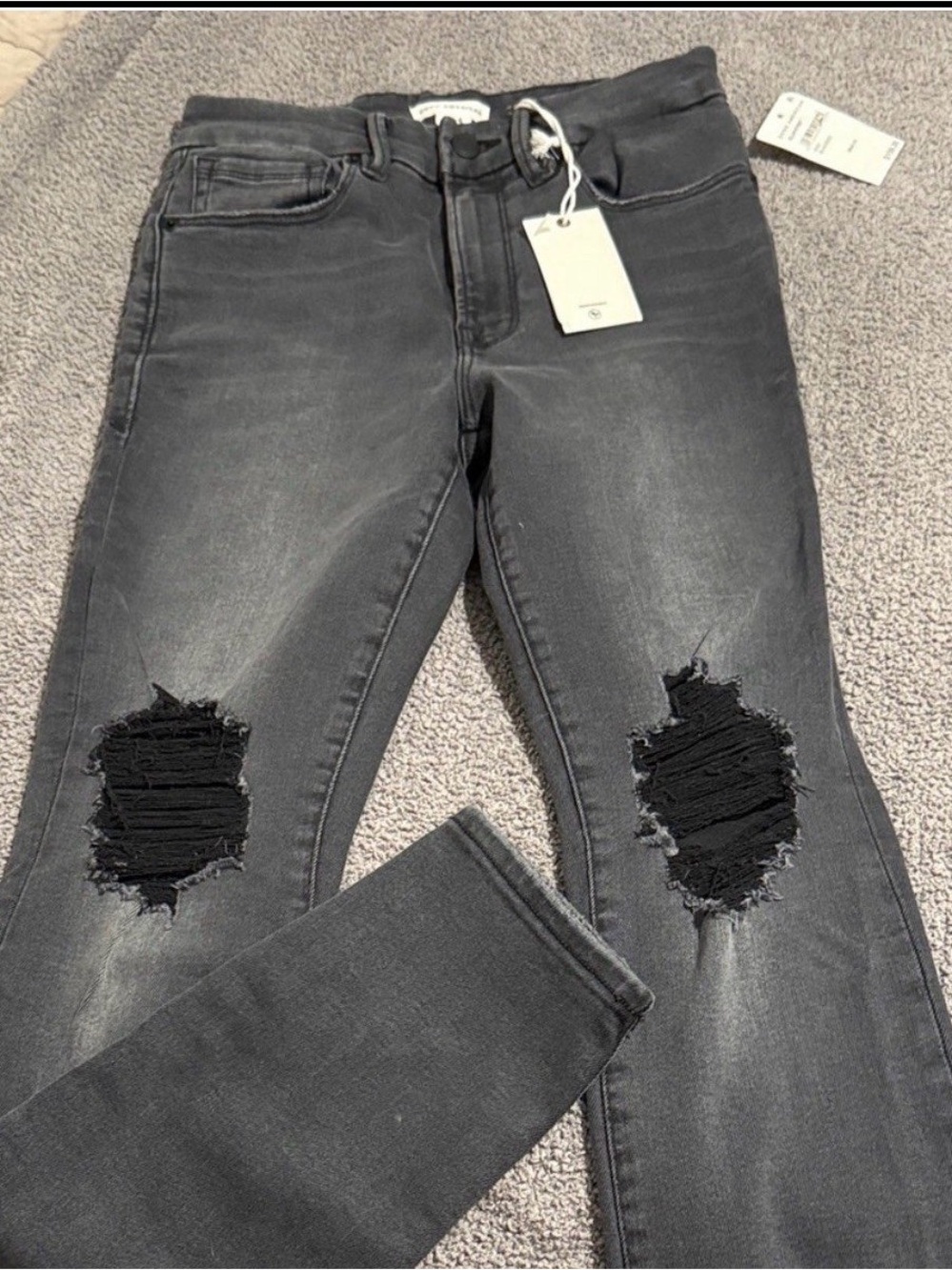 Good American Black Washed Skinny Jeans with Knee Rips